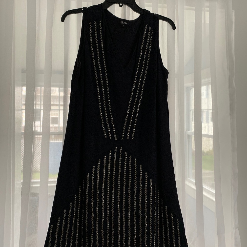 Navy Aline dress embellished with metallic beads.